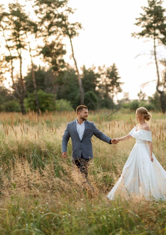 bride and groom on a walk in the woods